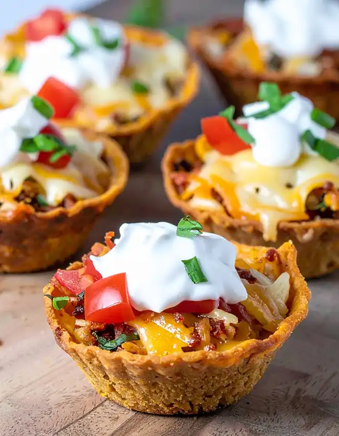 Taco cups with ground beef and melting cheese