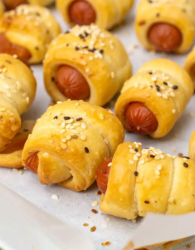 Easy pigs in a blanket topped with sesame seeds