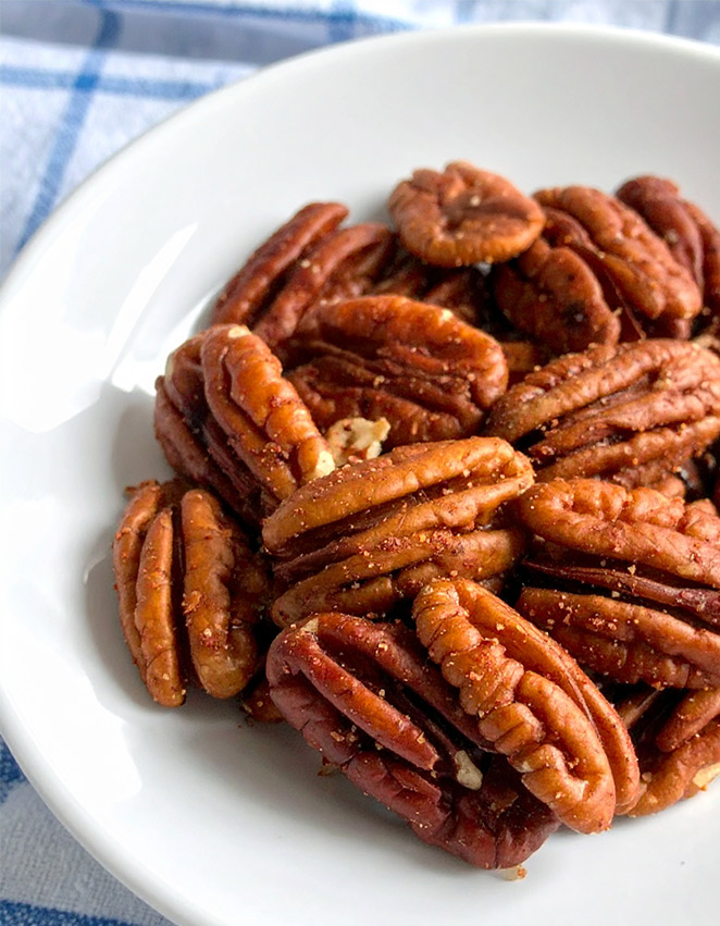 A plate of sweet and spicy roasted pecans