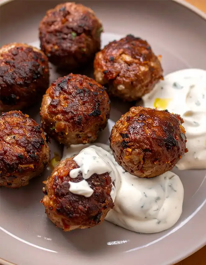Baked lamb meatballs with Greek lemon sauce