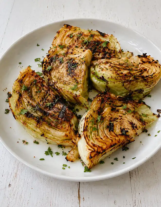 A plate of grilled cabbage with smoked paprika