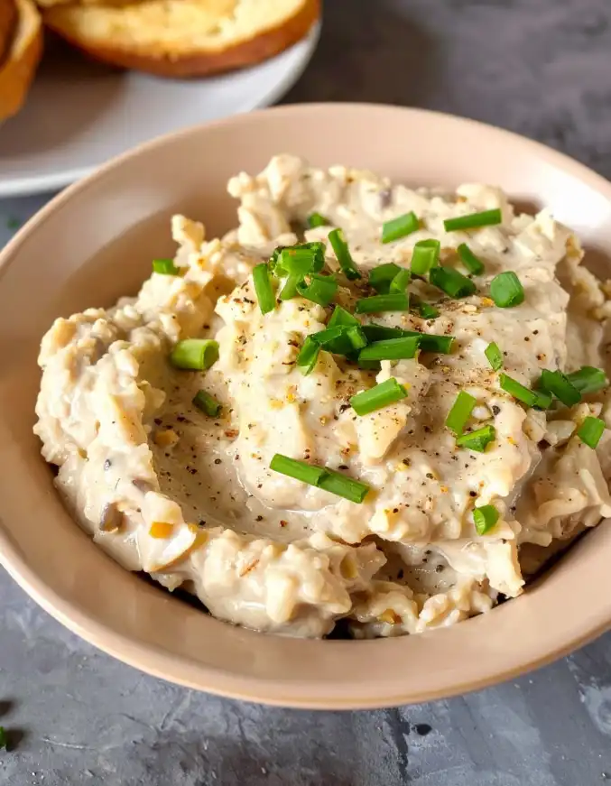 Clam dip with minced clam meat, garnished with chopped chives