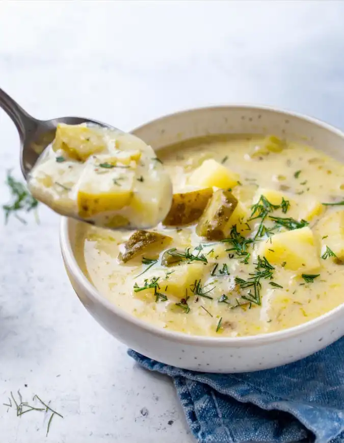 A bowl of rich and smooth Dill Pickle Soup with potatoes