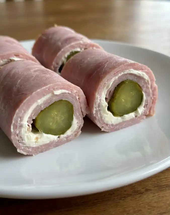 A plate of Ham pickle roll ups