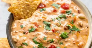 Chorizo Queso Dip with canned tomatoes and green chilies, sprinkled with chipped cilantro