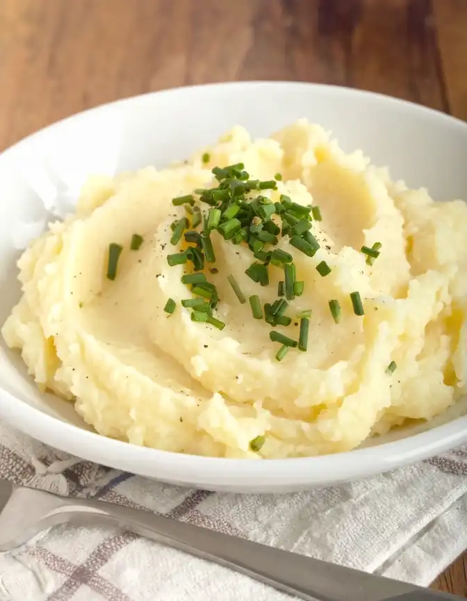 creamy garlic Mashed Potatoes, topped with chopped chives